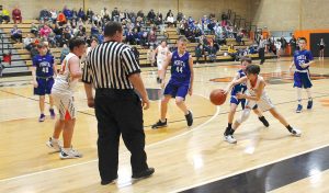 The 7th grade Tiger’s Ashten Guzman attempts the bounce pressure under heavy pressure from the PORTA defense.