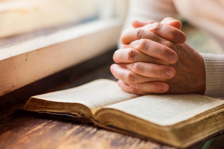 Hands on the bible