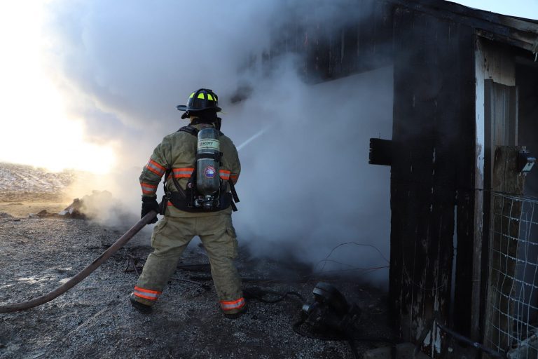 An area Firefighter putting out the fire. Photo by Beardstown Volunteer Fire Department