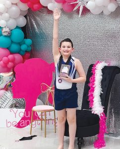 Gavin Cristman is shown receiving his plaque and medal after winning the title on beginner trampoline for the boys. He is a 6th grader at Brown County School with parents, Jason and Heather Cristman of Mt. Sterling.