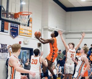 Exauce Mulumba gets the rim for basket in the Tigers regional loss to Illini West.