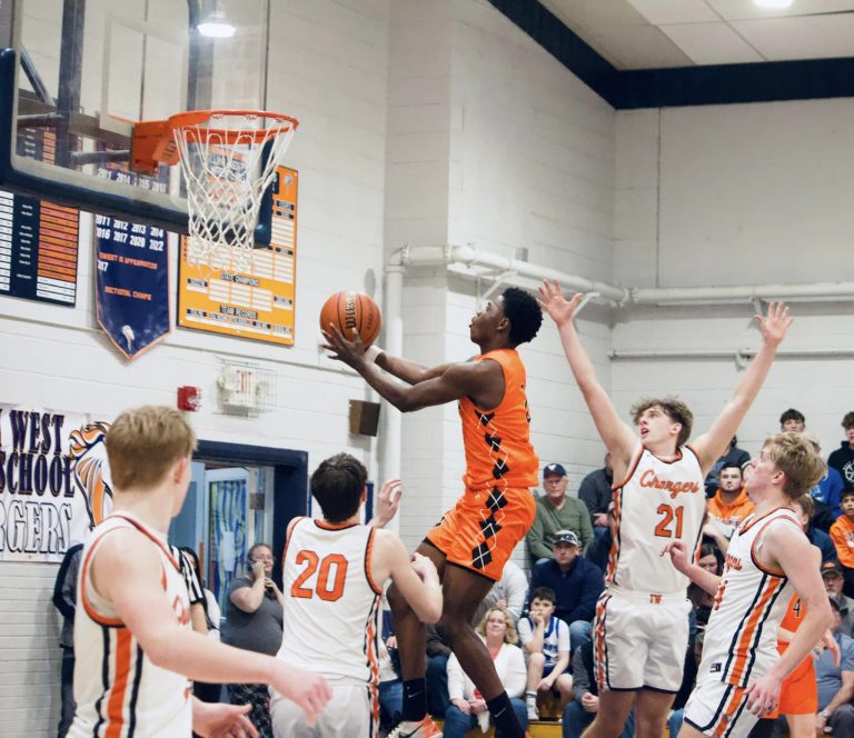 Exauce Mulumba gets the rim for basket in the Tigers regional loss to Illini West.