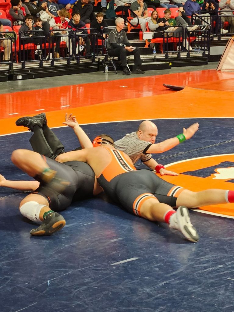 Garrett “Chunk” Dailey gets a pin for the win at the IHSA State Wrestling Tournament. The Tiger junior finished up a great season but did not place, going 1-2 in the tournament.