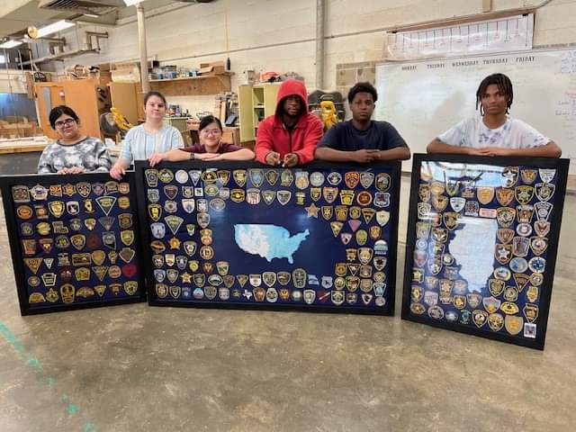 Three frames of police patches is shown above that Beardstown Police Department has been collecting for several years.