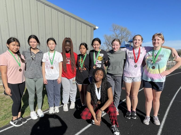 Members of the BHS girls track team are pictured with their medals following the opening meet of the season at Illinois College.