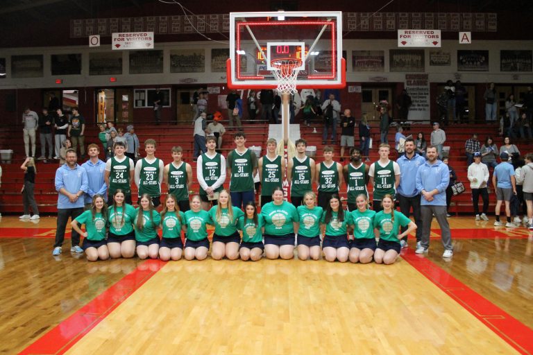 The Triopia-Meredosia-Virginia boys' basketball coaching staff and cheerleaders are pictured with the North Team who they helped to victory in the 44th edition of the Country Financial West Central Illinois All-Star Classic.