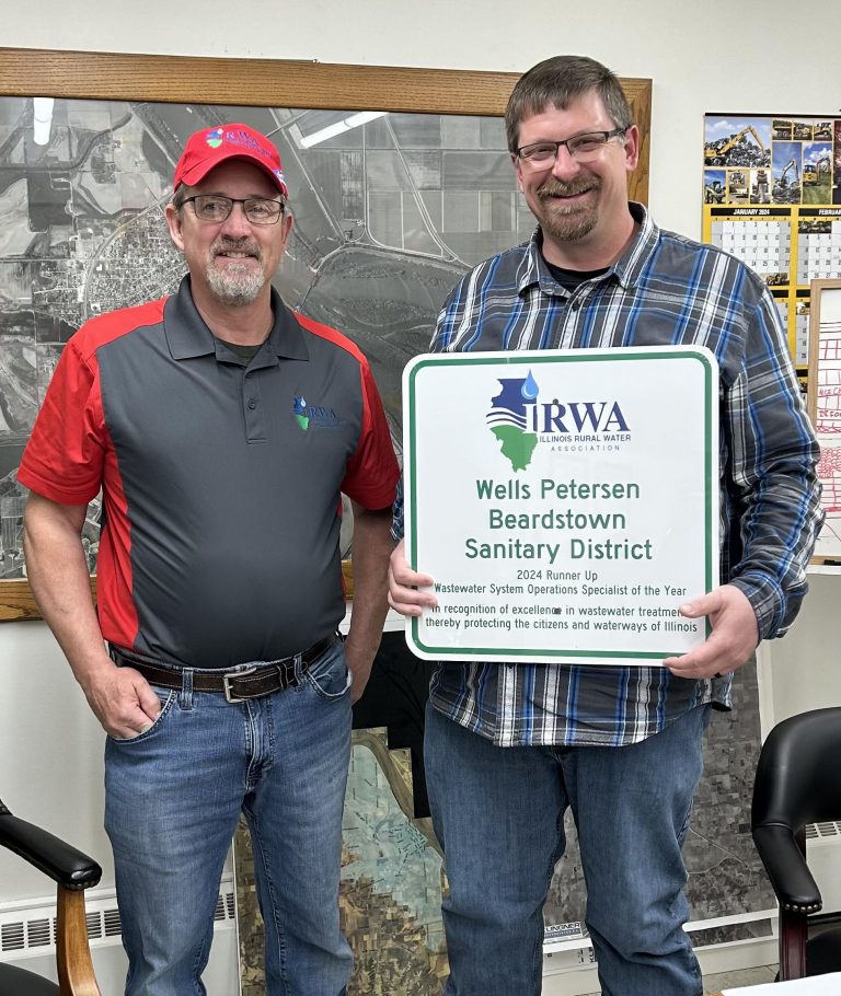 Pictured above on left Scott Tozier, IRWA, and Petersen, right.