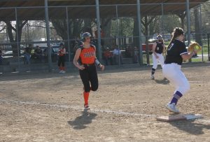 Shelby Goodrich digs hard for first base in Beardstown’s loss to Rushville/Industry.