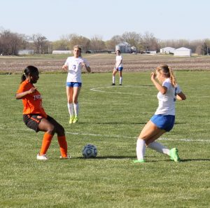 Pictured above is Christagie Zambele of Beardstown battles an Auburn Trojan for the ball. The girls fell to a very athletic Auburn team 6 to 1 as the Trojans spoiled that part of the evening. Earlier in the week the Tigers defeated Springfield Southeast 2 to 0 behind goals from Jocelyn Ojeda and Ashley Gil and an assist by Xixi Marquez. On Thursday the girls shot down the Bombers at Macomb 2 to 0. Marquez had both goals and Ojeda had an assist. The Lady Tigers improved to 8-2-2 on the season.