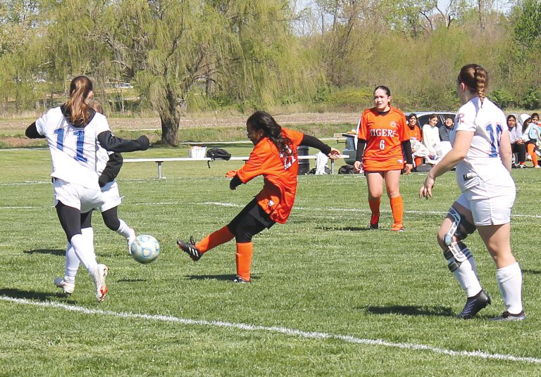 Xixi Marquez scores for BHS despite four Riverton defenders and the goalie between her and the goal.
