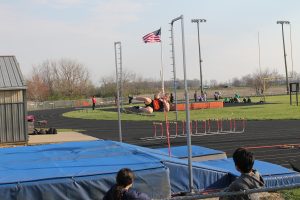 The Tigers Ola Quigley just clears the bar in the pole vault for the Tiger Junior High Track Team.