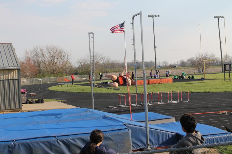 The Tigers Ola Quigley just clears the bar in the pole vault for the Tiger Junior High Track Team.
