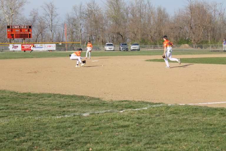 Tiger shortstop Colby DeSollar moves into position for a ground ball in home baseball action.