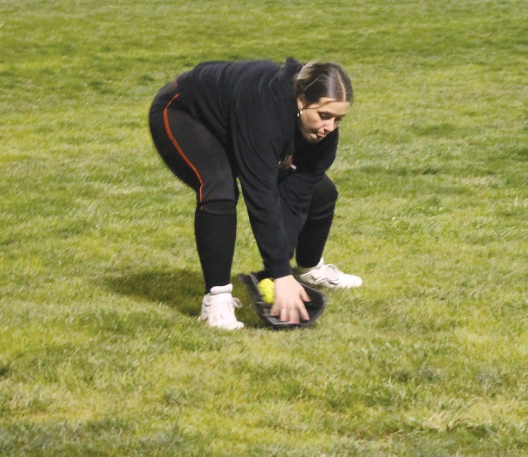 Hallie Lawson fields the ball in left field for Beardstown during the Lady Tiger Showcase.