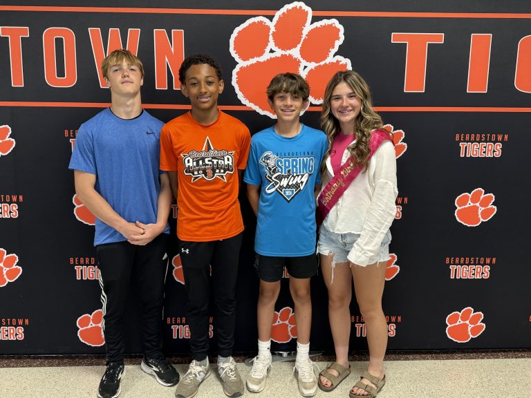 The Beardstown Middle School contingent of (L/R) Kellen Brown, DeWade Gaffney, Ashten Guzman and Ola Quigley are pictured after the "Walk of Champions" before they left for the IESA State Track and Field Championships.
