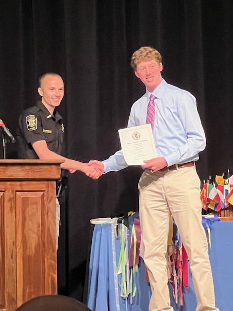 Sheriff Devron Ohrn presented PORTA Senior Trace Donnan with the Sheriff's Association Scholarship for Cass County.
