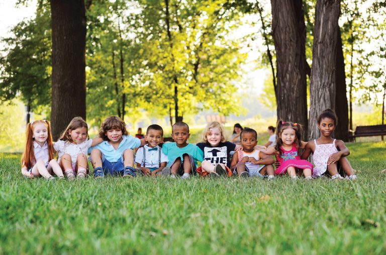 Kids sitting in grass