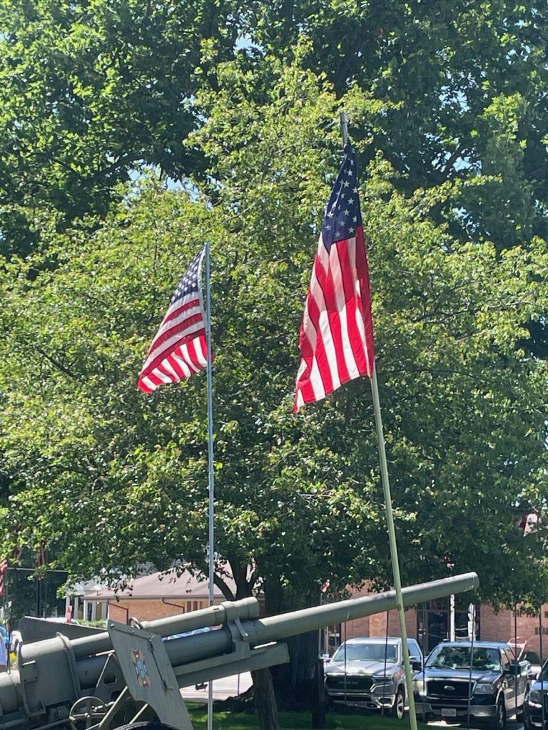 Flags fly surrounding the cannon in Art Zeeck Park. Photos by Brittney Taylor