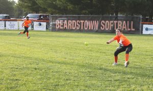 The right fielder cuts one off that was headed for the corner during Beardstown Little League Softball play.