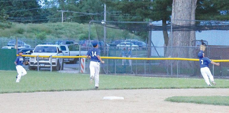 A short pop up falls just out of the reach of the second baseman.