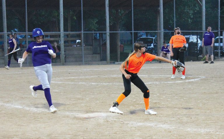 Out at first in a close one in 11/12 year old softball action at Rice Field.
