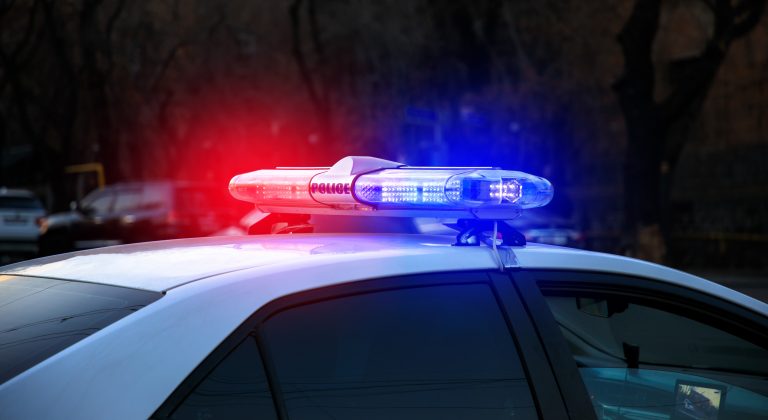police car in the night light street