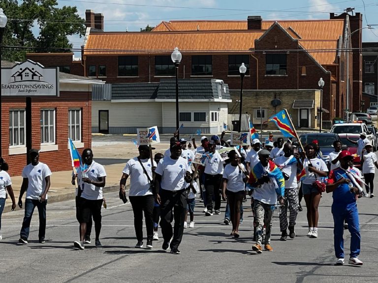 Chants of "Stop the Genocide" filled the air as members of the Congolese Community were escorted by the Beardstown Police Department and the Cass County Sheriff's Department to Art Zeeck Park.