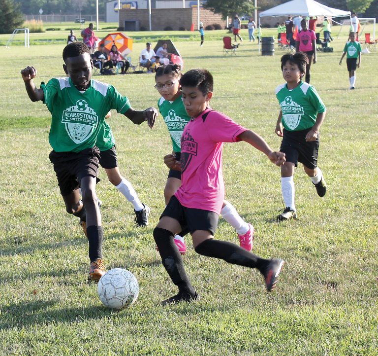 Two players arrive at the ball simultaneously.