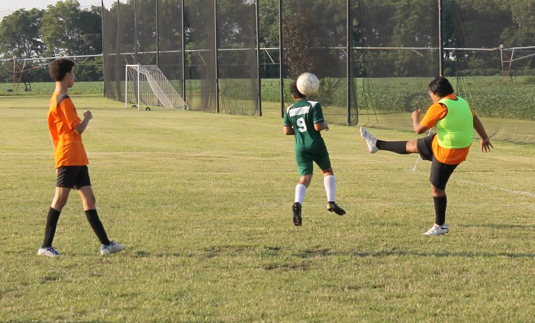 The goalie launches a kick deep to the other end.