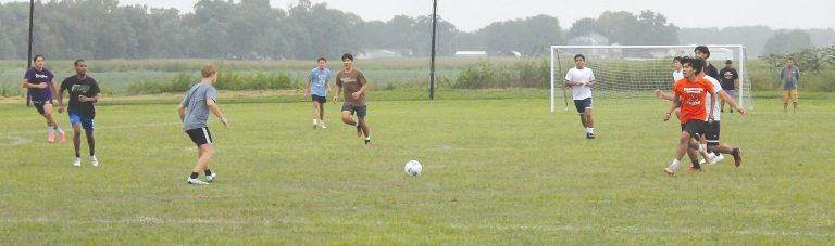 It’s a race for the ball during the opening soccer practice of the year for the Beardstown Tigers.