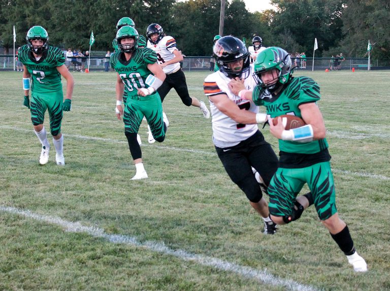 Despite the runner’s hand on his facemask, Heller forces the ball carrier out of bounds.