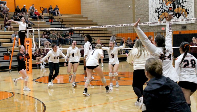 The Lady Tigers are all smiles after beating Havana in the Tiger Den.