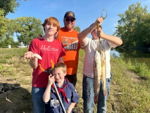 Some happy fishermen with their catch at the Boy Scout Fishing Derby.