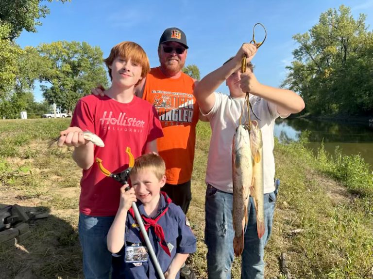 Some happy fishermen with their catch at the Boy Scout Fishing Derby.