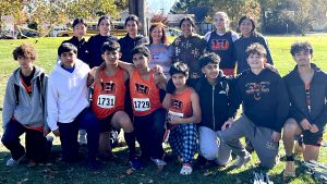 The boys and girls Cross Country teams for Beardstown and coach Jacki Kelly are pictured after the Regional Meet where the Tigers qualified for Sectionals.