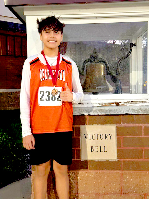 Tiger middle school Cross Country runner Uriel Torrijos-Gil is shown with his medal from the Liberty Invite.