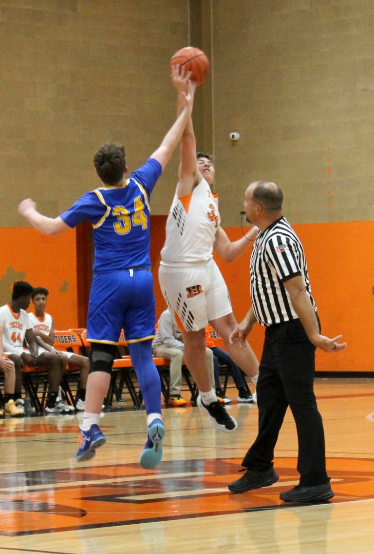 The Tigers’ Tucker Sorrells goes up high to win the tip off for the Beardstown eighth graders.