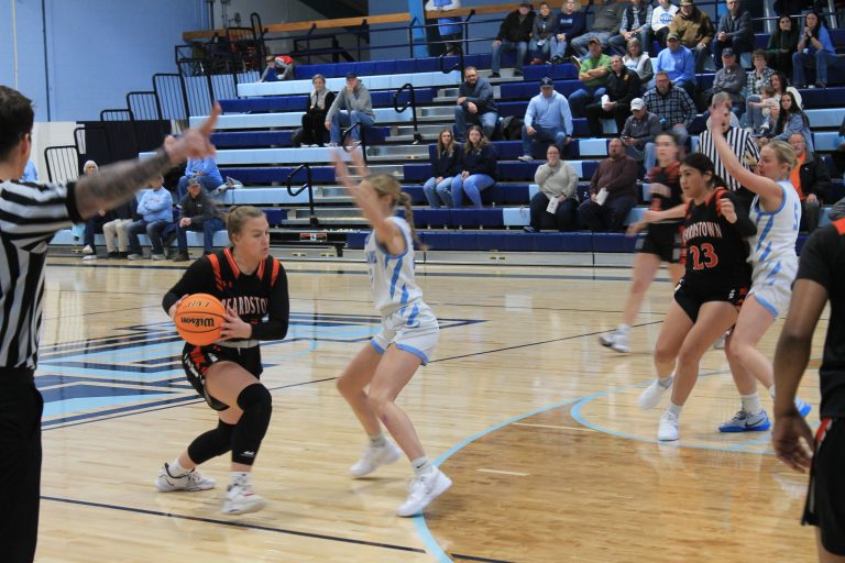 The Tiger’s Kylynn Maltby looks to drive on Triopia-Meredosia-Virginia’s Mylee Tracy.