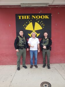 On Friday November 15, The Nook Lounge held a “Celebrity Bartender Fundraiser” for the Shop With A Cop organization. Volunteers from local businesses along with citizens all pitched in to bartend for the evening. Pictured is Doug Birdsley (center) giving a check to Terry Comiskey (left) and Sam Reller (right) in the amount of $2,275.00. A big thanks to all volunteers for this good cause.