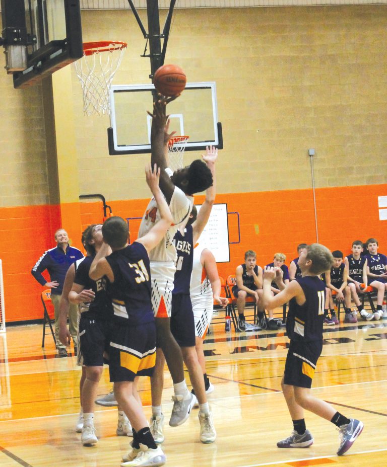 The Tiger’s Isaac Mutshupule goes up strong against Griggsville.