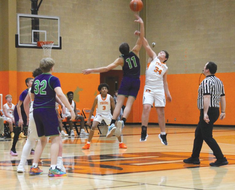 Beardstown’s Tucker Sorrells leaps high for the tip off against South Fulton.