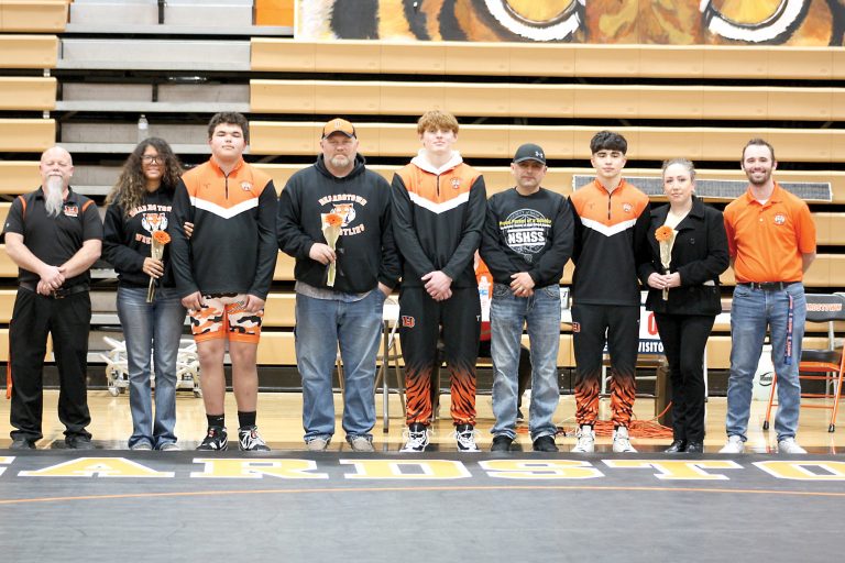 Pictured with their families from left to right are Beardstown Senior Wrestlers Garrett “Chunk” Dailey, Ryder Hamlin and Luis De La Cruz.