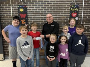 Each year Triopia Grade School students collect money to donate to a local organization. This year the students collected $1,204.84 for the Jacksonville Salvation Army. Pictured above are Easton Beard, Beau Turner, Hunter Beard, Representative David Turner, Spring Coleman, Annie Crews, Kohen Ohrn, Vivian Edwards, Jackson Richmond. Photo Triopia CUSD #27.