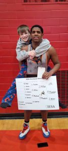 ude Dawson (left) and Pedro Mendoza ham it up after qualifying for the IESA State Wrestling Tournament. Mendoza was Sectional Champ at 275 pounds and Dawson took third at 80 pounds.